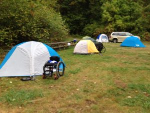 wheelchair in front of a tent