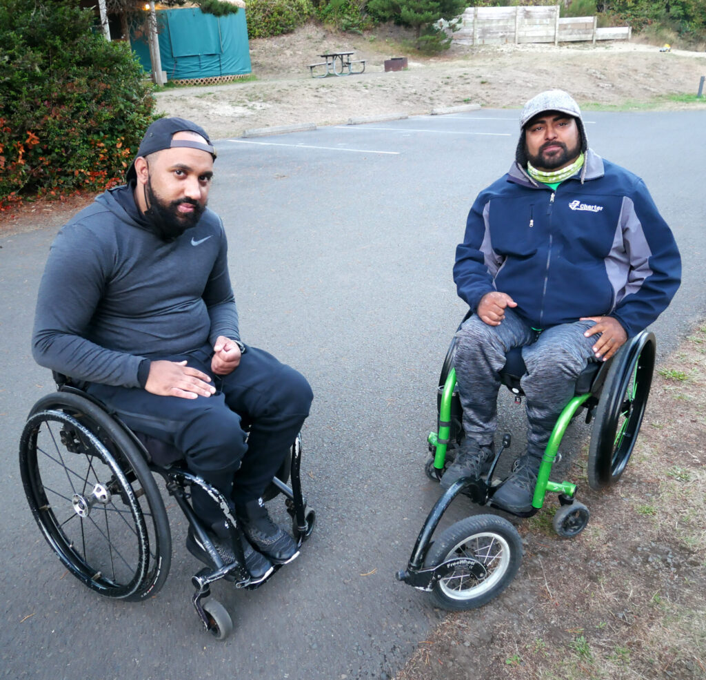 Two men in wheelchairs.